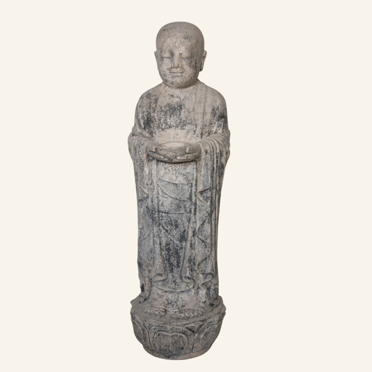 The standing Buddha statue in fiber cement